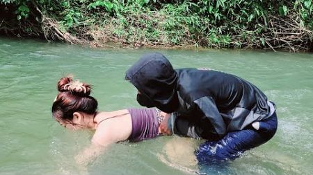 The girl went camping on the river bank and met the guy