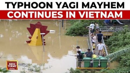 Vietnam Floods: People In Hanoi Wade Through Flood Waters In Wake Of Typhoon Yagi