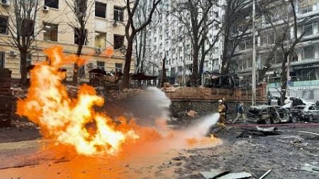 Damage buildings and burning cars in Kyiv city centre following Russian attack | AFP