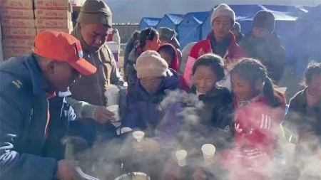 Fire brigade workers make warm food for people affected by quake